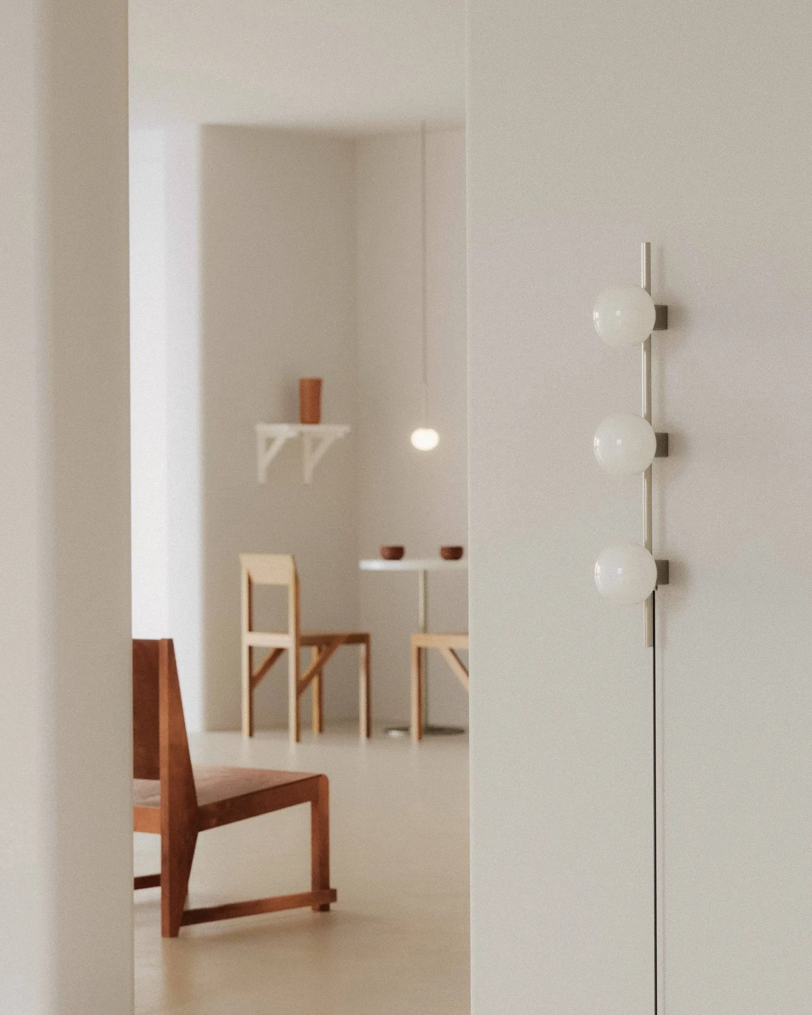 Ovoid Single wall lamp, Stainless steel-opal glass FRAMA