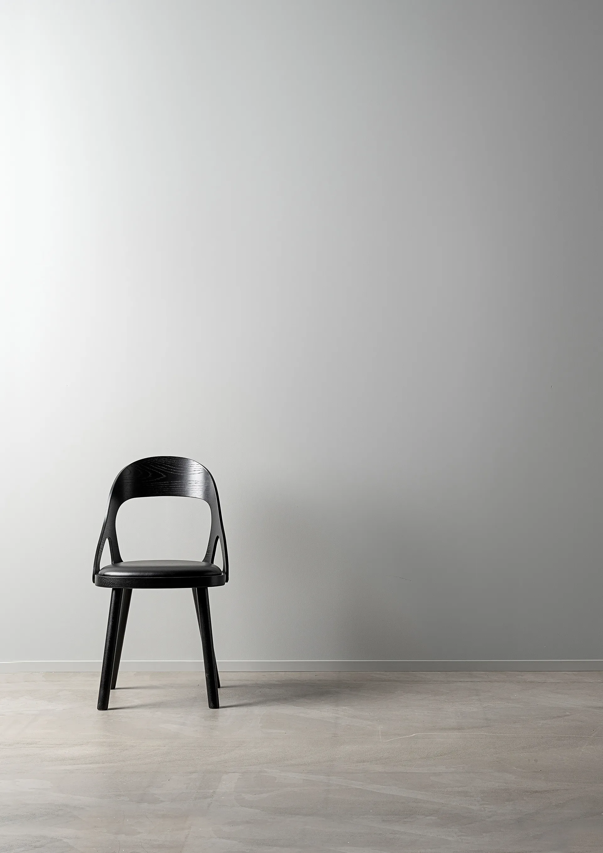 Colibri chair, Stained black oak-black pad Hans K