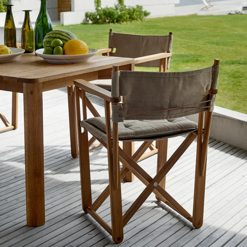 Kryss Dining armchair, Sunbrella Ashe light grey, teak Skargaarden