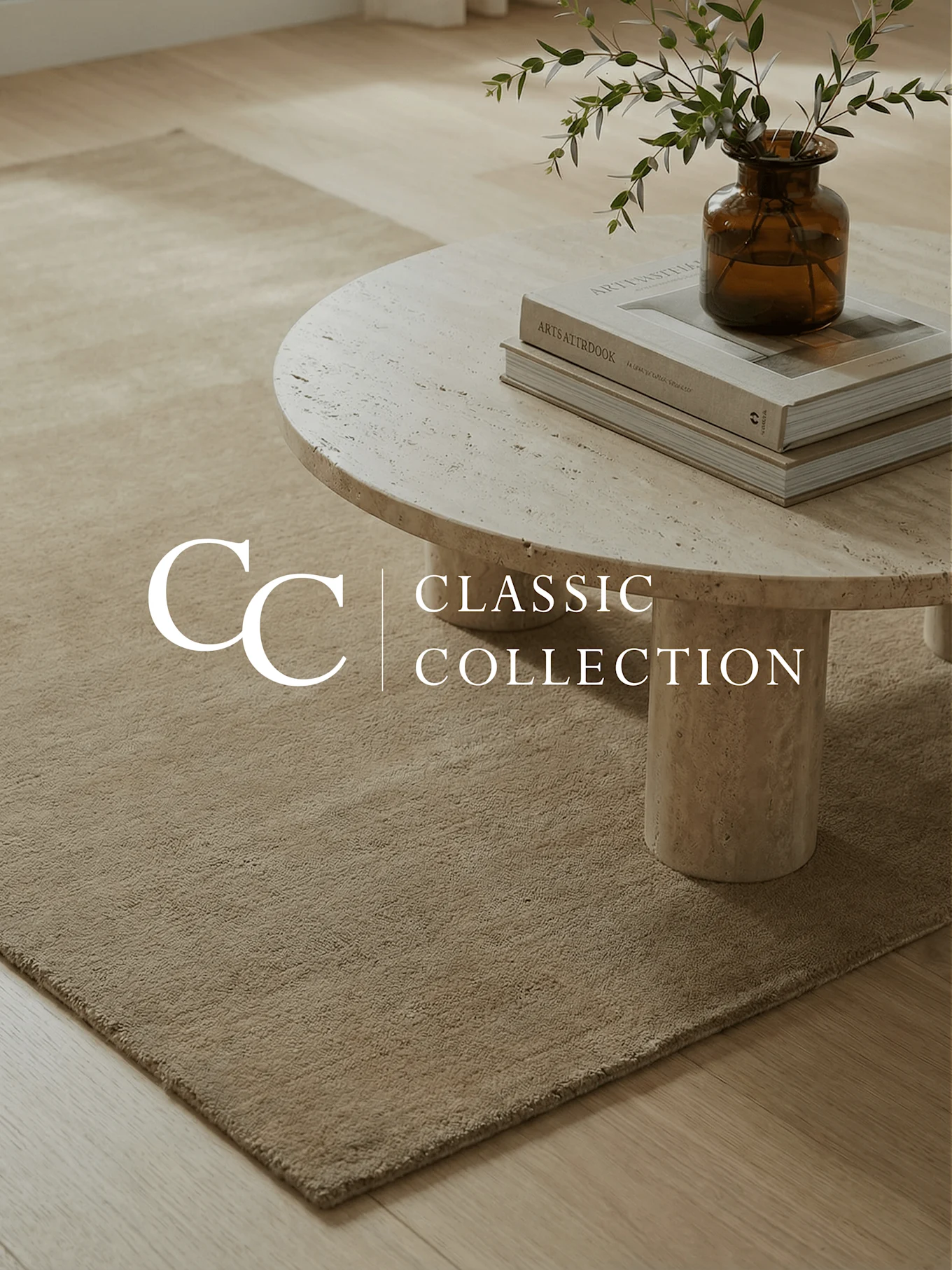 Light brown rug on wooden floor, travertine coffee table with books and a vase of green branches. Text: 'CC CLASSIC COLLECTION'.